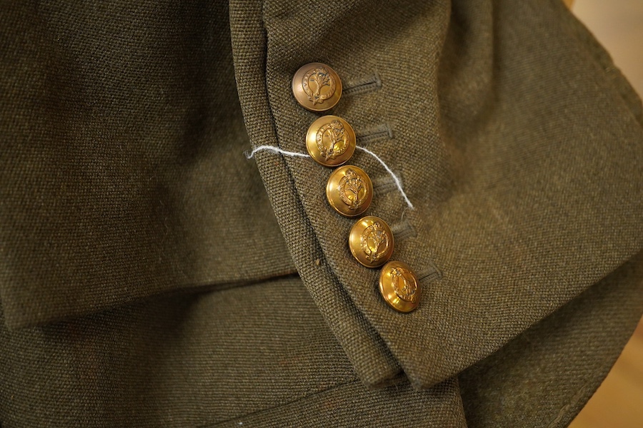 A WWII Welsh Guard’s uniform, comprising a dress jacket, two dress blouses, one with label stating 1940 Pattern Size No.6, breast 38” to 39”, waist 33” to 34”, a pair of breeches, a pair of trousers and a tie, together w